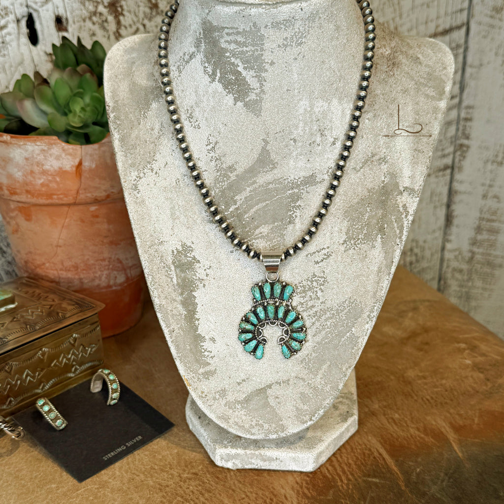 The Begay Sterling Silver Pearl Neckace with Turquoise Naja Pendant